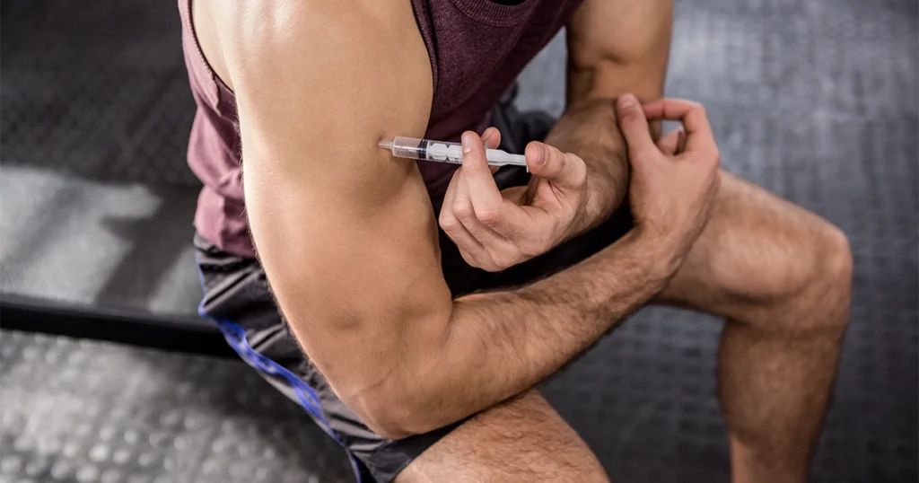 Testosterone Replacement Therapy injection in athlete's arm